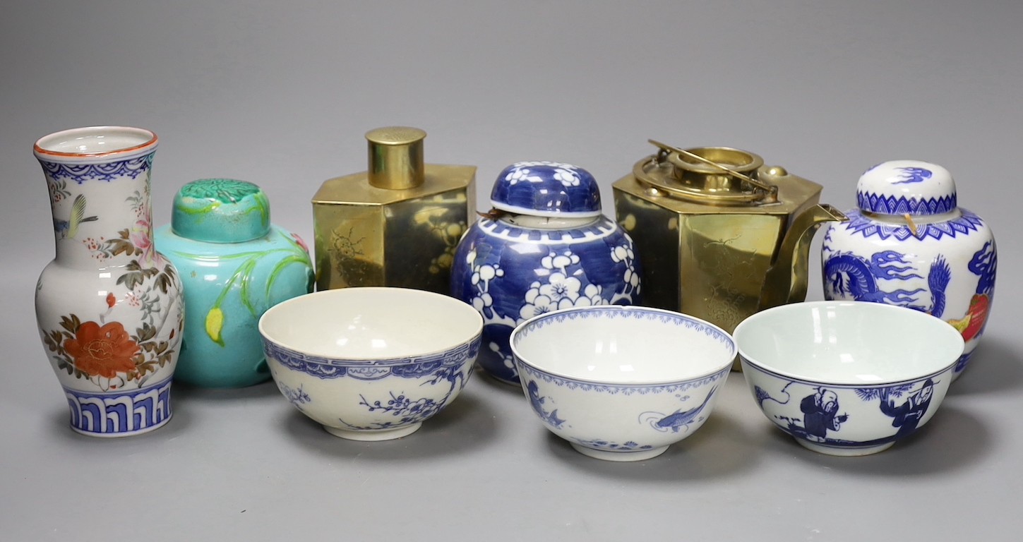 A Chinese brass tea caddy and kettle together with three similar blue and white porcelain bowls, three jars and covers and a Japanese vase